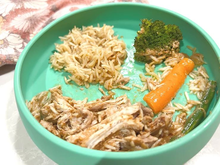 Butter Chicken Oven Bake with rice, broccoli, carrot and beans in green Suckie Scoop plate - Starting Solids Australia recipe.