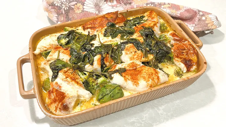 Lemony Chicken and Greens in baking tray with floral tea towel - Starting Solids Australia recipe.