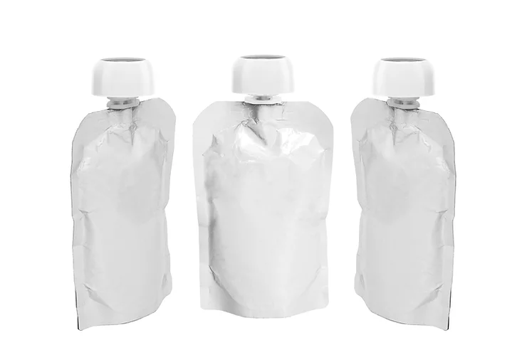 Three white soft yoghurt pouches with screw top lids.