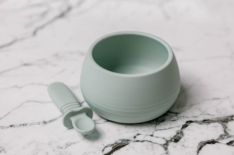 Suckie Scoop Bowl with Selfie Spoon by Starting Solids Australia, on a marble bench.