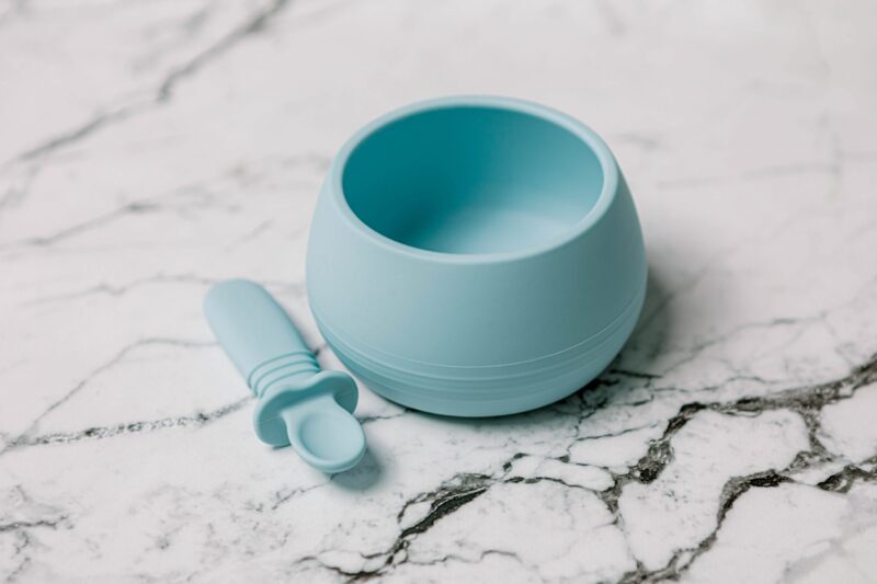 Suckie Scoop Bowl with Selfie Spoon in 'Blue Lemonade' by Starting Solids Australia, on a marble bench.