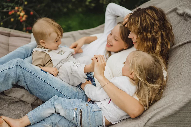 Mother and three children in a hammock.