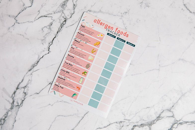 Allergen Food Tracker laying on a marble bench by Starting Solids Australia