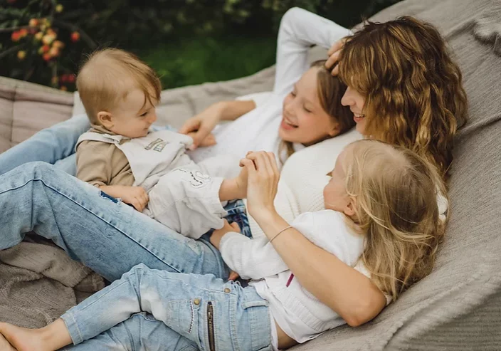 Mother and three children in a hammock.