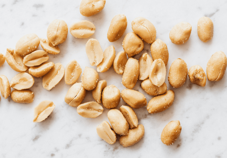 peanuts scattered on a marble bench